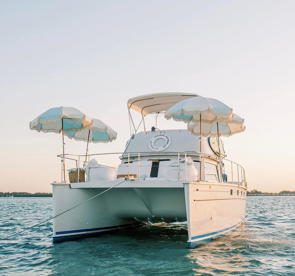 a boat with umbrellas on the water