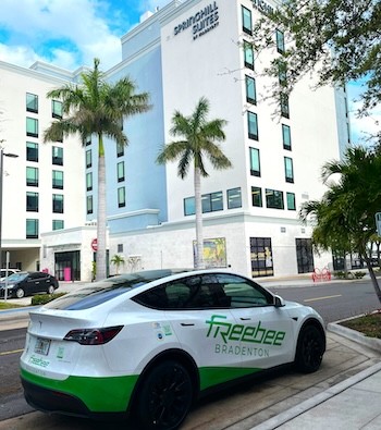 A Freebee sedan car parked outside of the Springhill Suites in downtown bradenton