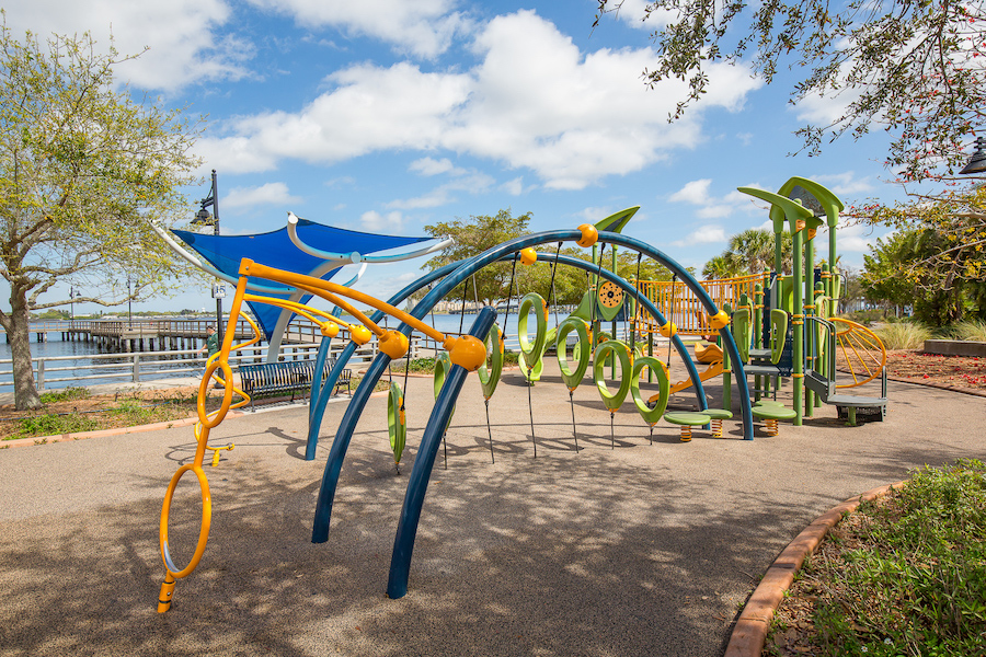playground on the bradenton riverwalk with a view of the manatee river in the background